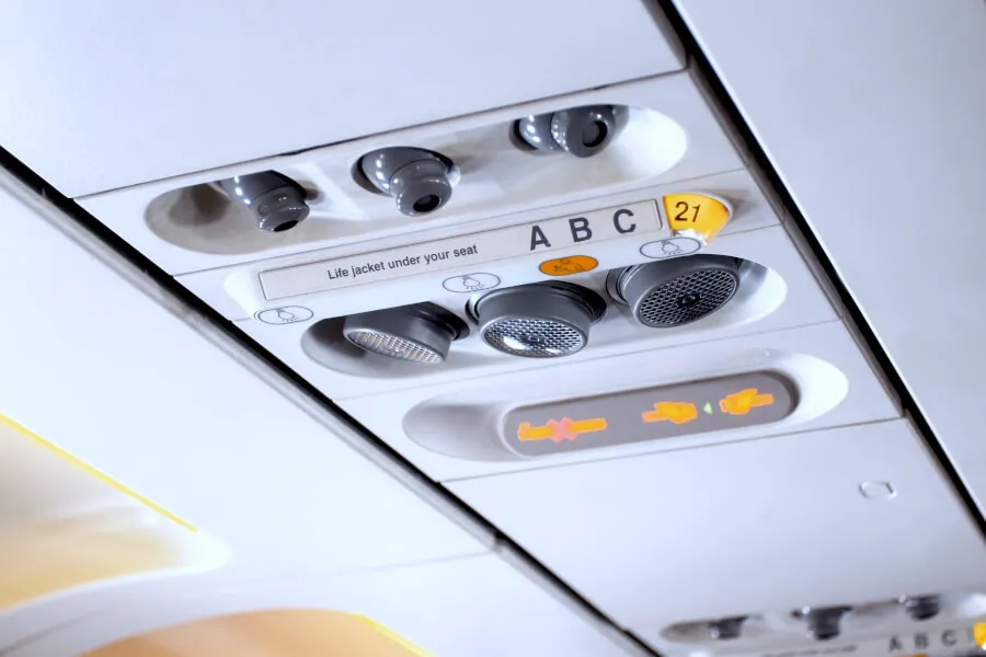 Airplane overhead panel with seat indicators.