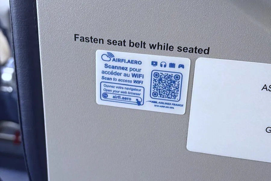 Airplane seatbelt sign and WiFi QR code